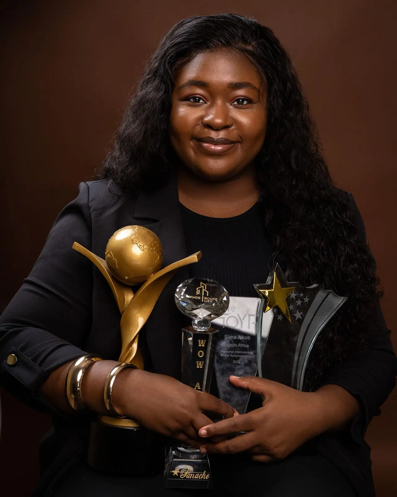 Elma Akob receiving award